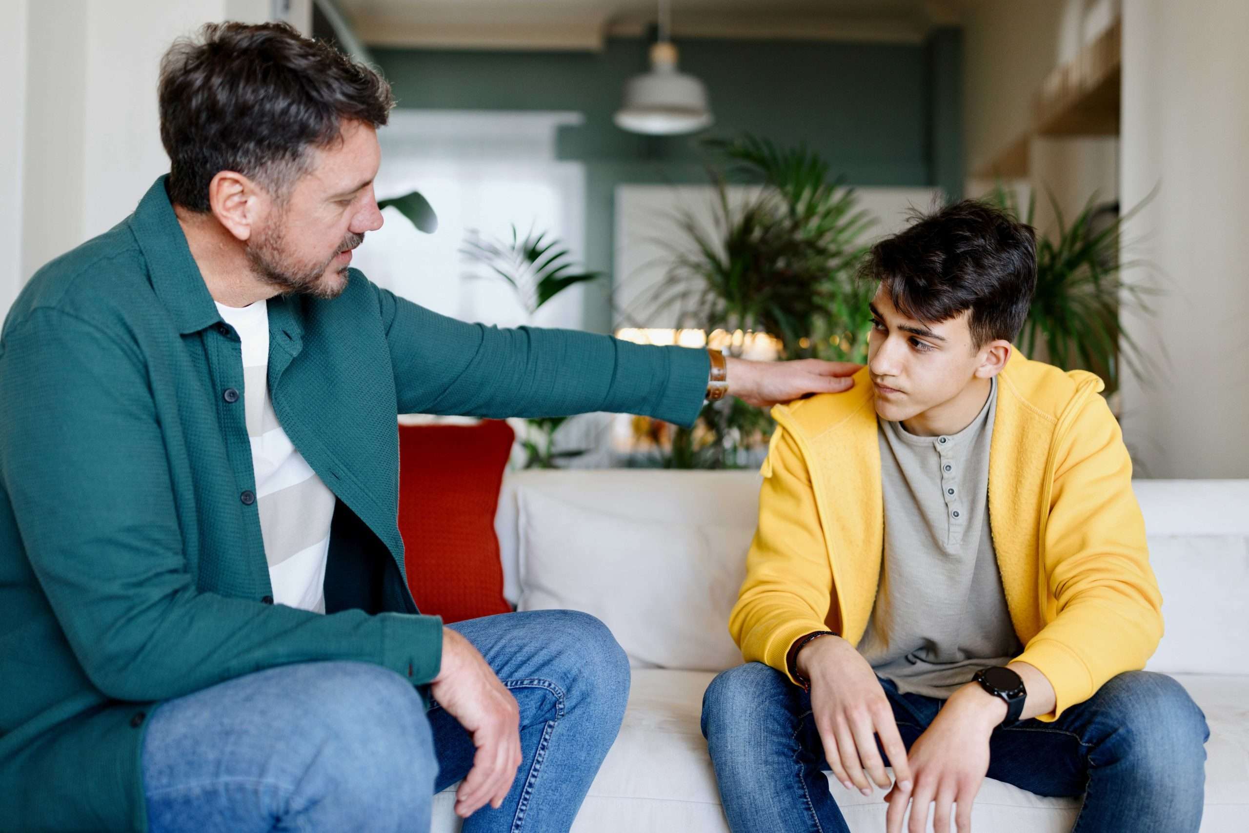 A-teenager-talking-about-school-bullying-with-his-father