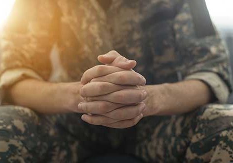 Portrait-of-middle-aged-sad,-desperate-military-man-during-therapy-session.-Disabled-soldier-suffering-from-depression-psychological-trauma.-PTSD-concept