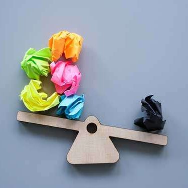 Work-Career-Therapy-1 Scales-and-paper-balls-as-symbol-of-positive-and-negative-thoughts